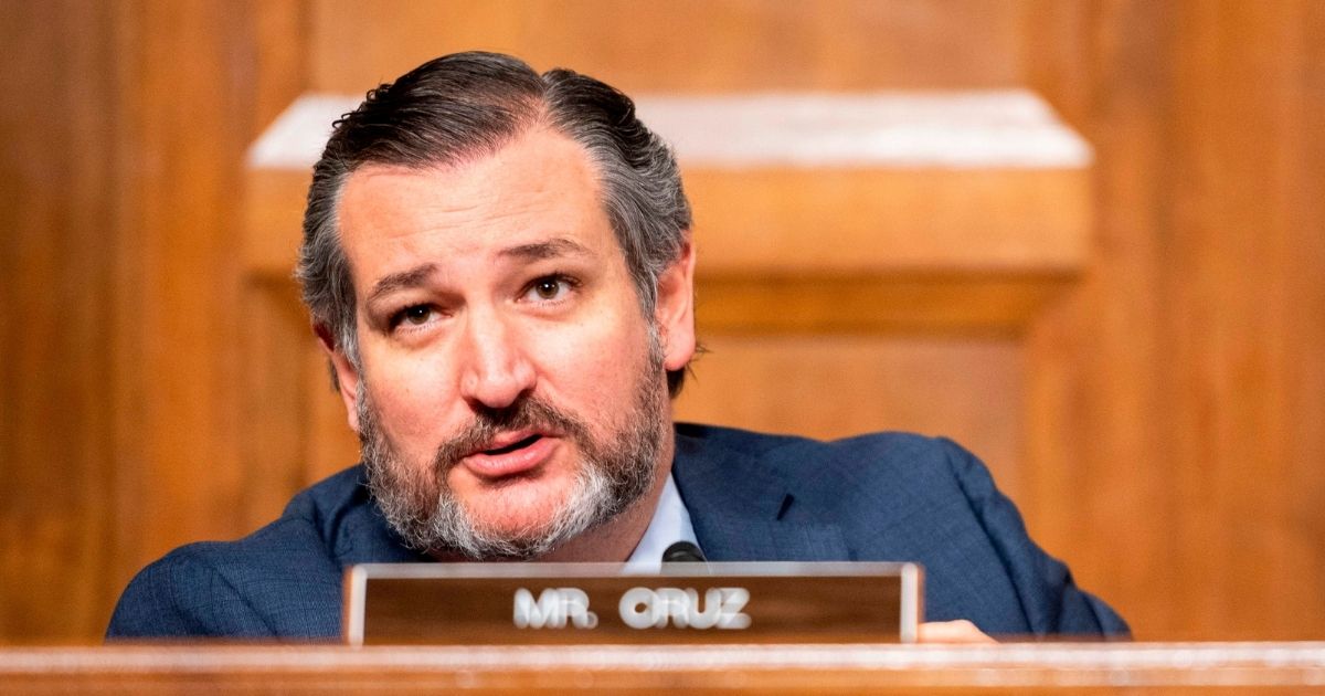 Republican Sen. Ted Cruz of Texas questions Facebook CEO Mark Zuckerberg and Twitter CEO Jack Dorsey during a Senate Judiciary Committee hearing on Capitol Hill on Tuesday.
