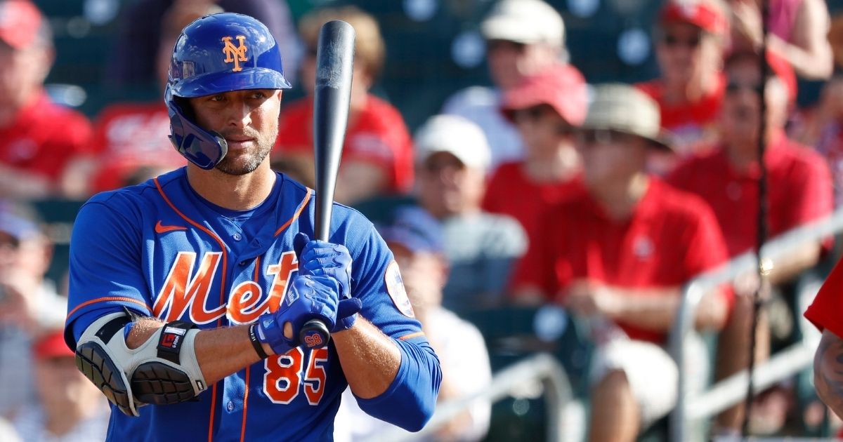 Tim Tebow #85 of the New York Mets looks on before stepping to the plate to bat against the St Louis Cardinals during a Grapefruit League spring training game at Roger Dean Stadium on March 5 in Jupiter, Florida.