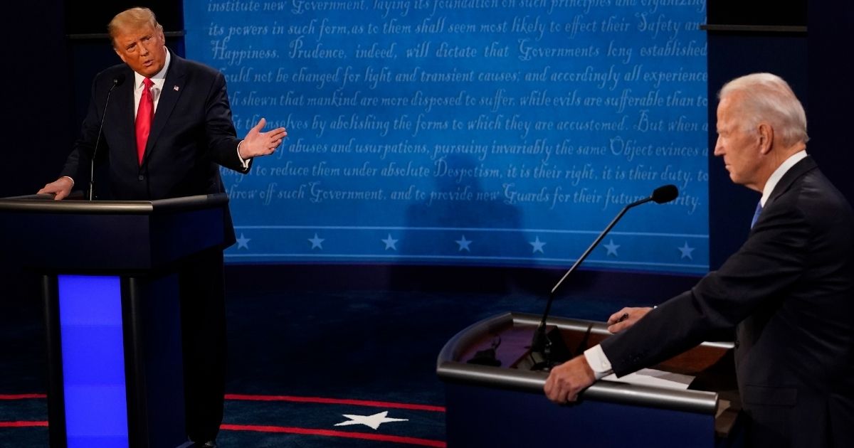 President Donald Trump gestures toward Democratic presidential candidate Joe Biden during their at Belmont University in Nashville, Tennessee, on Oct. 22.