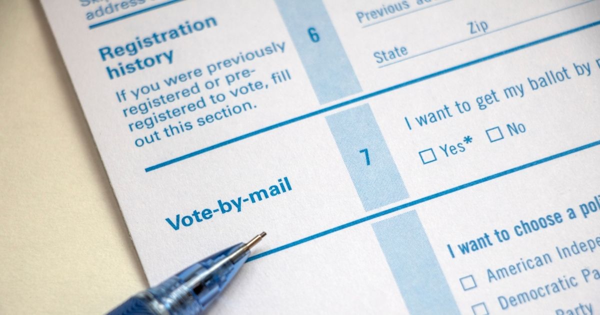 A voter registration form is seen in the stock image above.
