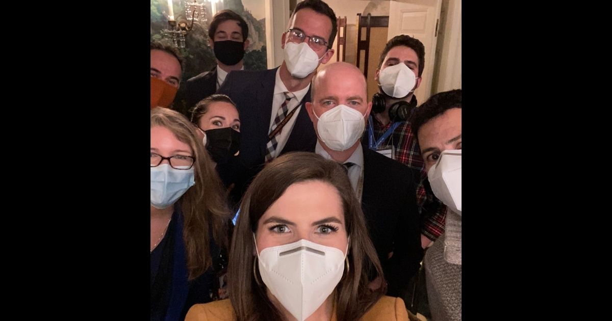 CNN White House correspondent Kaitlan Collins poses with other reporters.