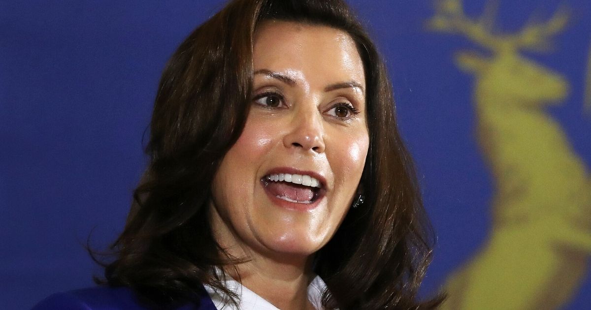 Michigan Gov. Gretchen Whitmer introduces Democratic presidential candidate Joe Biden at the Beech Woods Recreation Center in Southfield on Oct. 16.