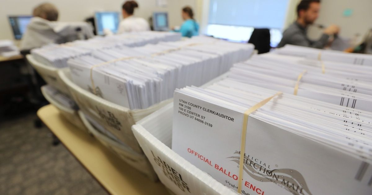 Thousands of ballots sit in boxes on Nov. 6, 2018, in Provo, Utah.