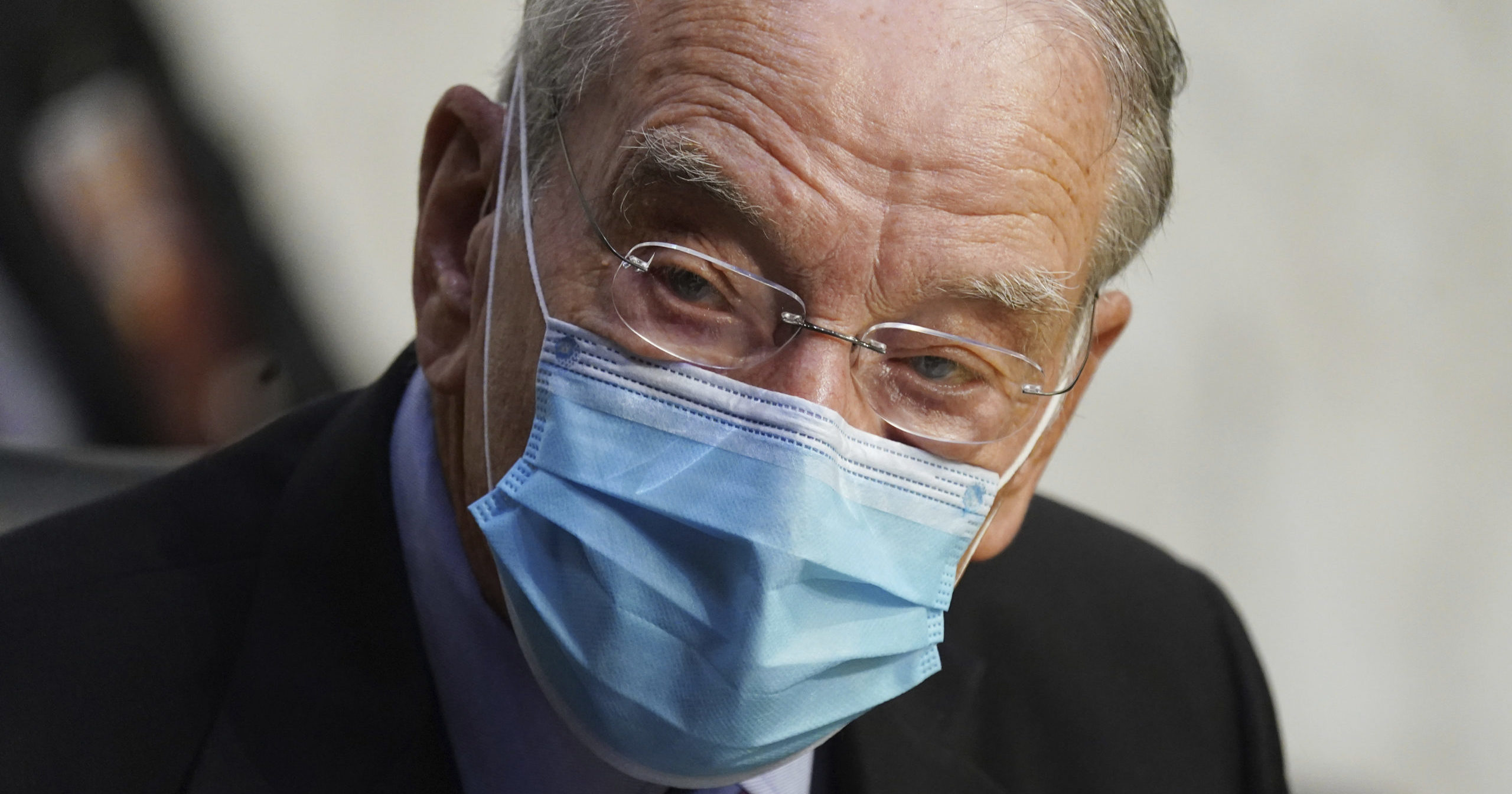 In this Oct. 12, 2020, file photo, Sen. Charles Grassley of Iowa listens during a confirmation hearing for Supreme Court nominee Amy Coney Barrett before the Senate Judiciary Committee on Capitol Hill in Washington, D.C.