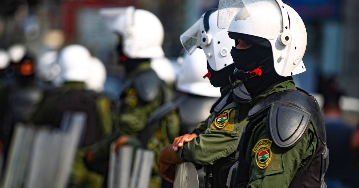 Iraqi policemen stand guard during an anti-government protest in Baghdad on Nov. 8, 2020.