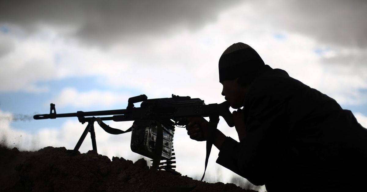 A fighter from Jaish al-Islam, a rebel group that opposes the Islamic State group, holds a position on the eastern outskirts of Damascus on Jan. 23, 2016.
