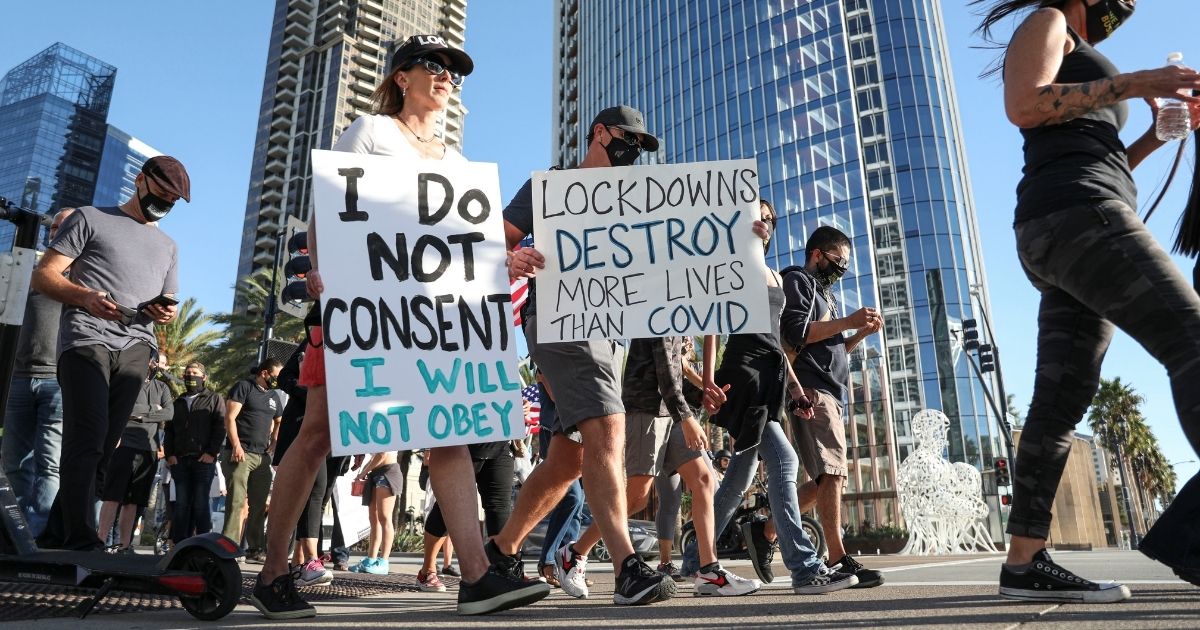 Business owners and local leaders protest against lockdown measures on Nov. 16, 2020, in San Diego, California.