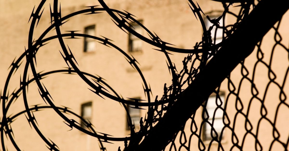 A barbed wire fence is seen in this stock image.