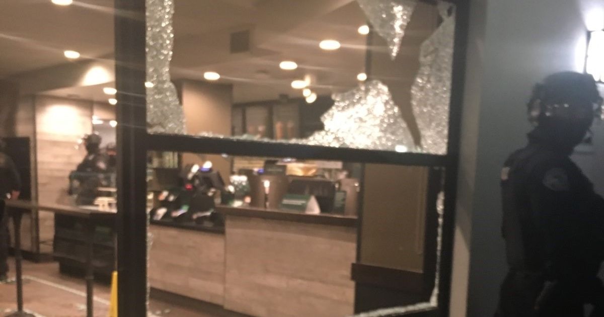 A group of rioters in Portland smashed windows at a local college and attempted to set a building on fire on Nov. 3, 2020.