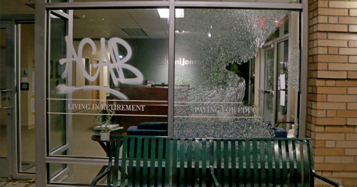 Shattered glass on a storefront and an anti-police acronym mark the latest round of rioting in Portland, Oregon.