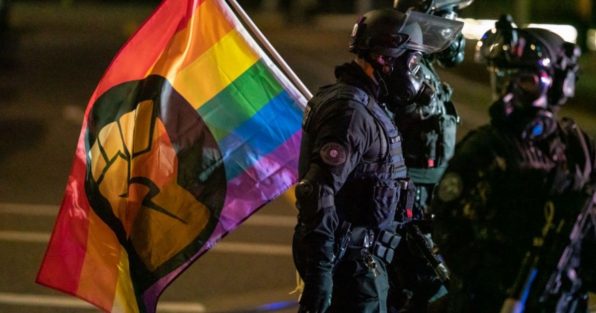 Portland police confiscate a protesters' flag on Oct. 7, 2020, in Portland, Oregon.