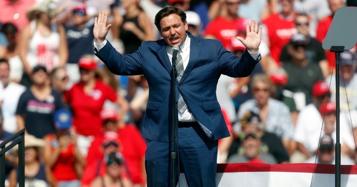 Florida Gov. Ron DeSantis speaks to supporters of President Donald Trump before he arrives to give a campaign speech outside of Raymond James Stadium on Oct. 29, 2020, in Tampa, Florida.