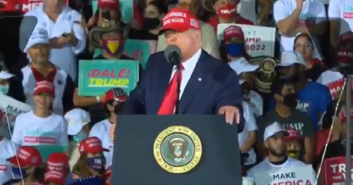 President Donald Trump addresses a crowd of supporters Sunday in Miami.