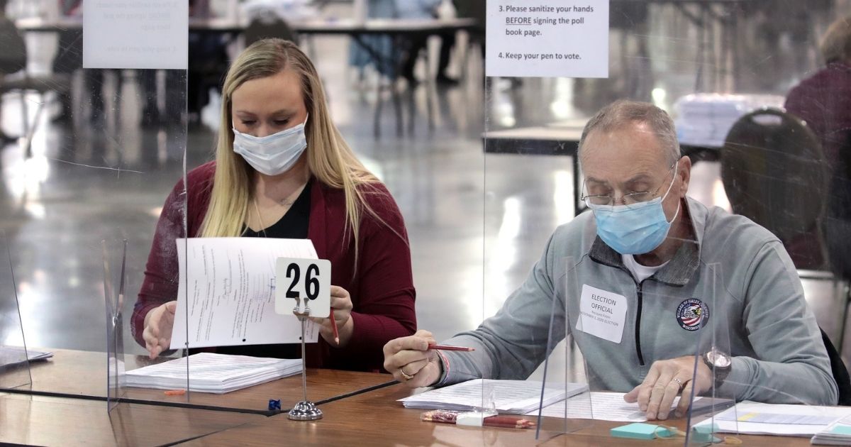 Election workers begin the recount of ballots from the Nov. 3 election on Nov. 20, 2020, in Milwaukee, Wisconsin.
