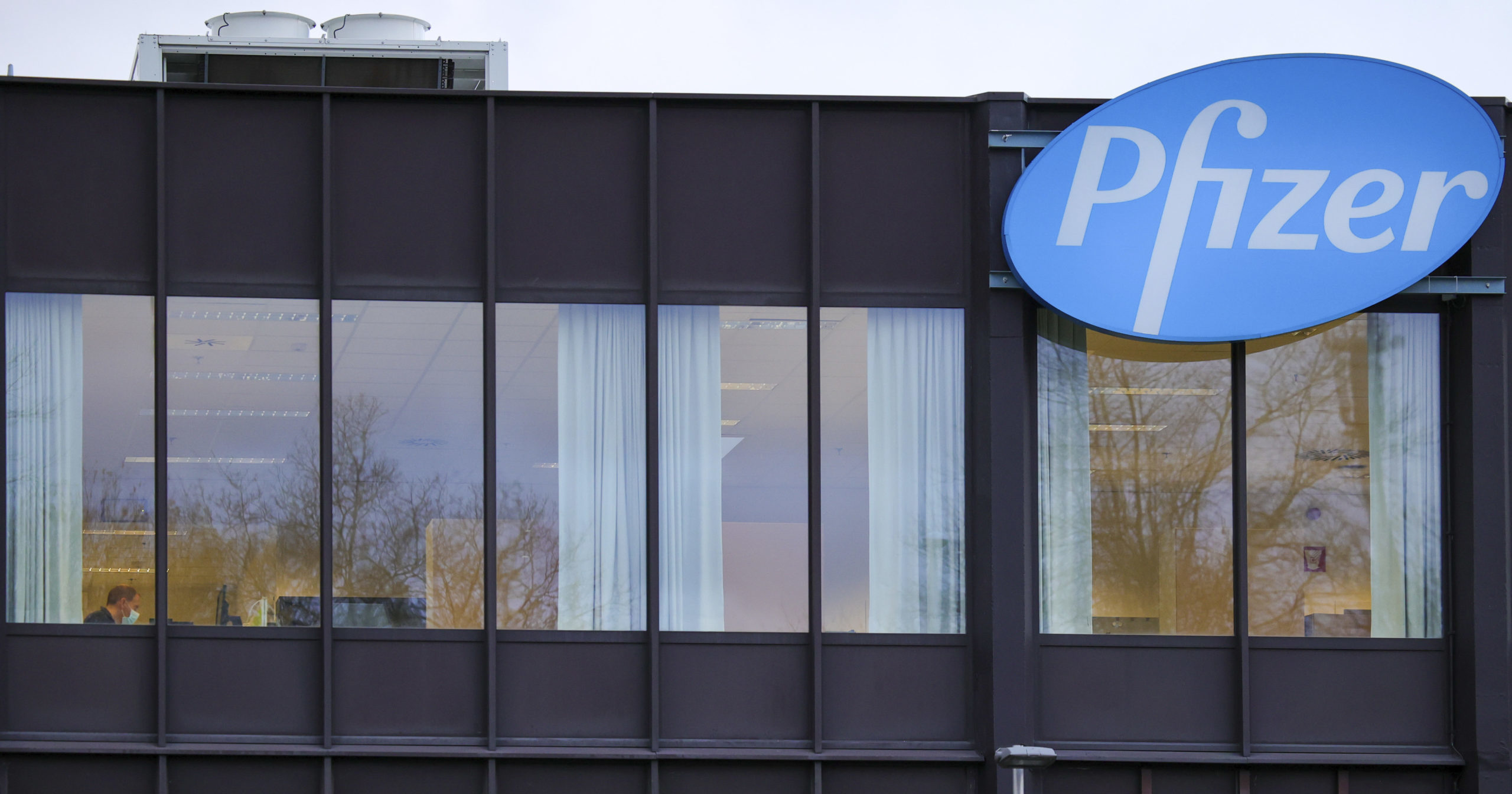 In this Dec. 4, 2020 file photo, the Pfizer Manufacturing plant is seen in Puurs, Belgium.