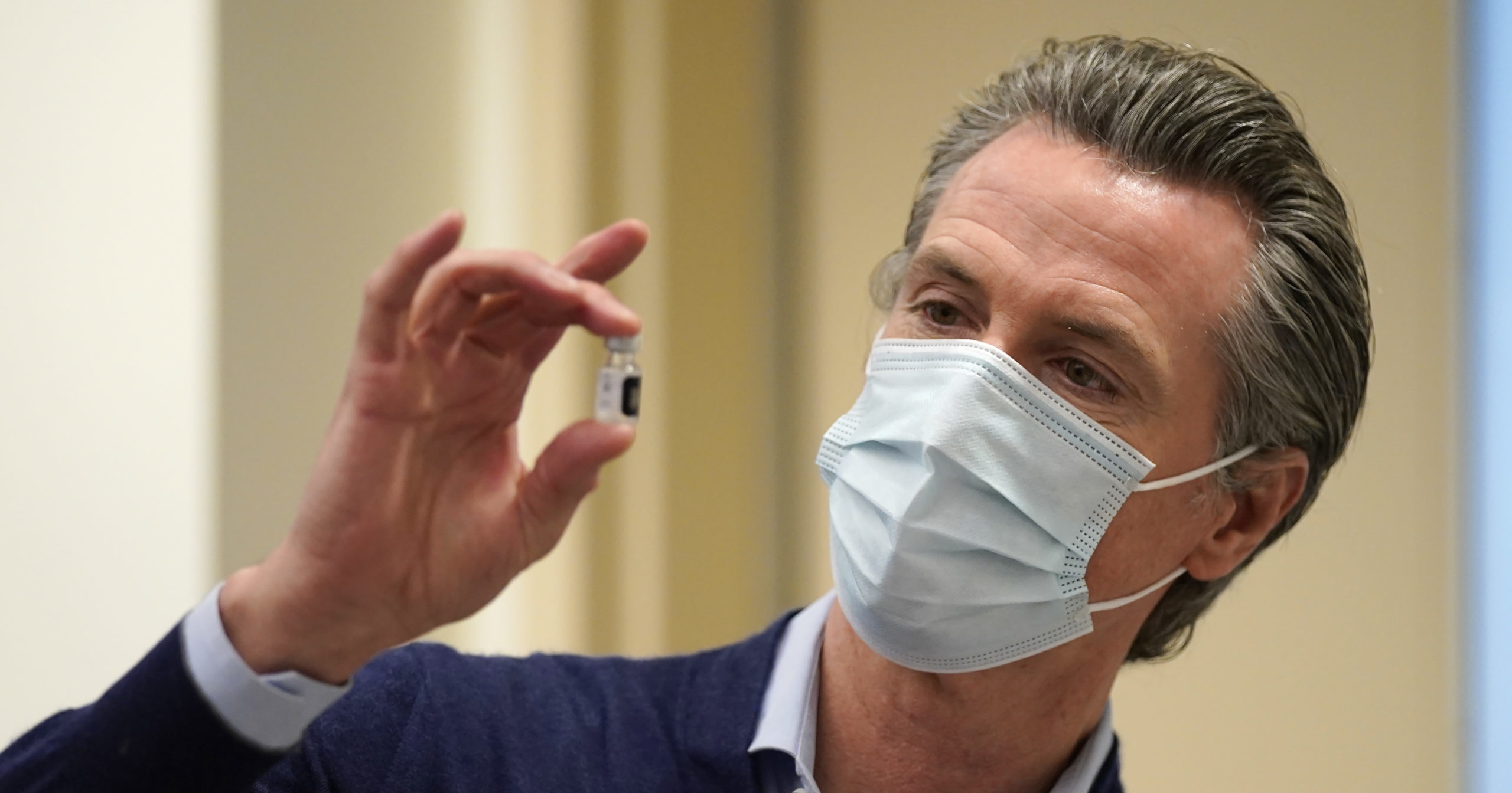 California Gov. Gavin Newsom holds up a vial of the Pfizer-BioNTech COVID-19 vaccine at Kaiser Permanente Los Angeles Medical Center in Los Angeles on Dec. 14, 2020.