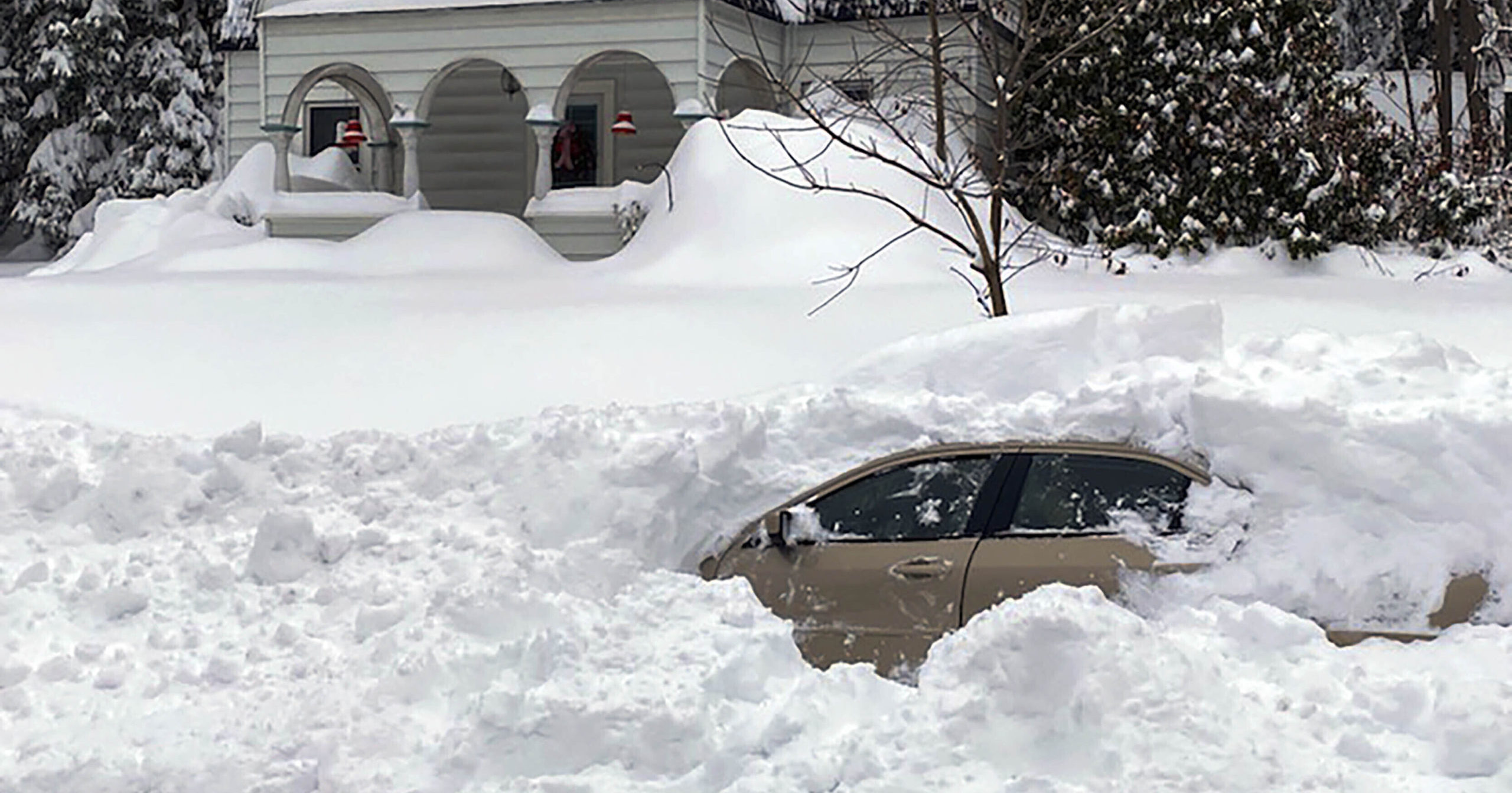This photo shows a car in Owego, New York, from which a New York State Police sergeant rescued Kevin Kresen, 58, who was stranded for 10 hours, covered by nearly 4 feet of snow thrown by a plow.
