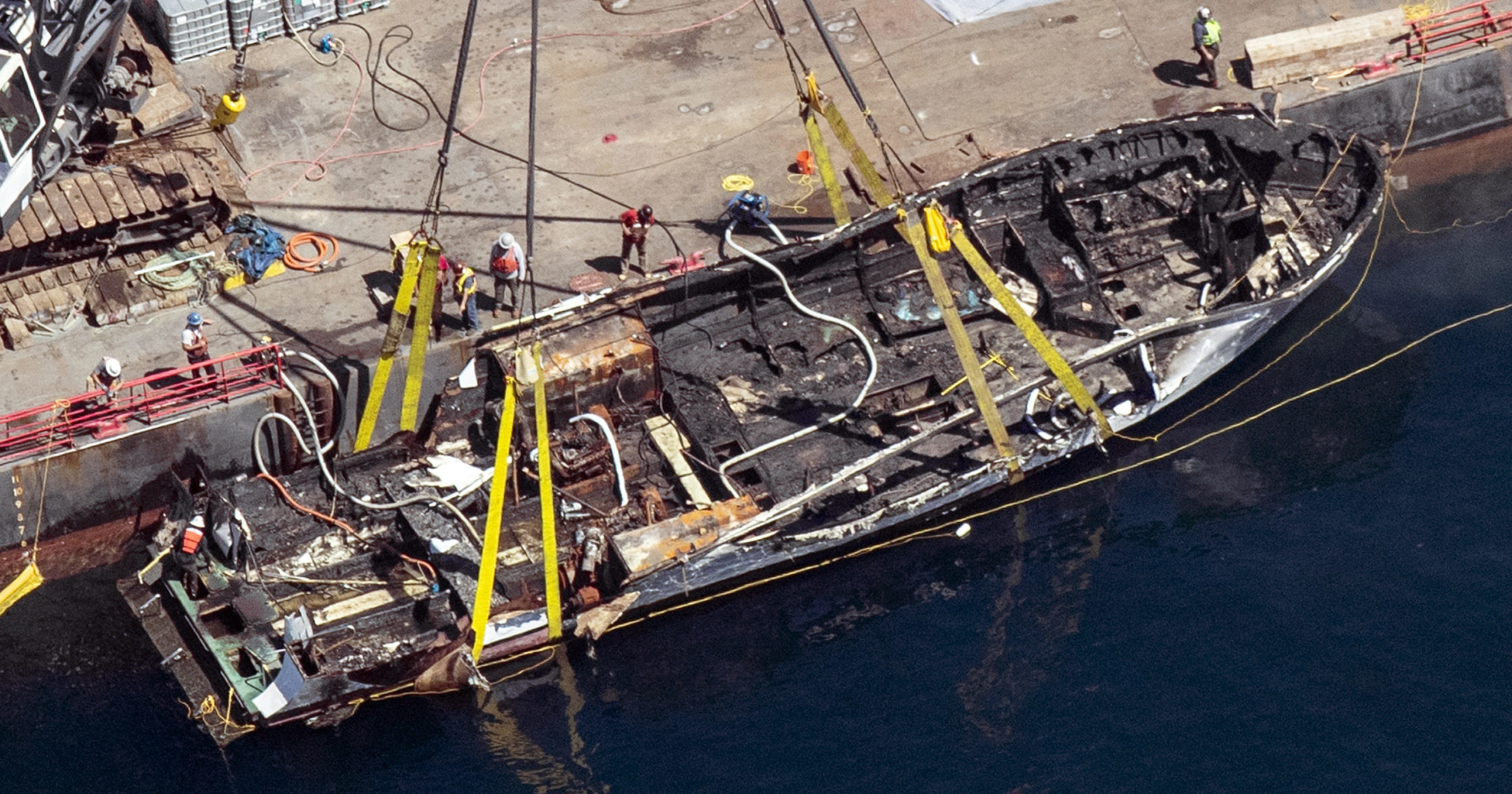 In this Sept. 12, 2019, file photo, the burned hull of the boat Conception is brought to the surface by a salvage team off Santa Cruz Island, California.