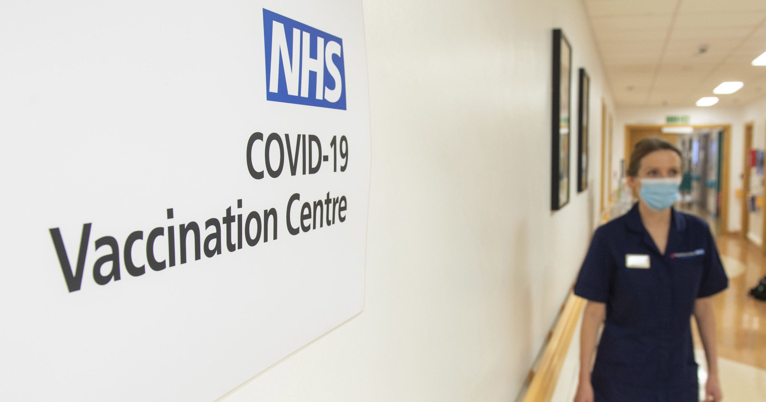 Signs for the COVID-19 Vaccination Centre are seen at the Royal Free Hospital in London on Dec. 7, 2020.