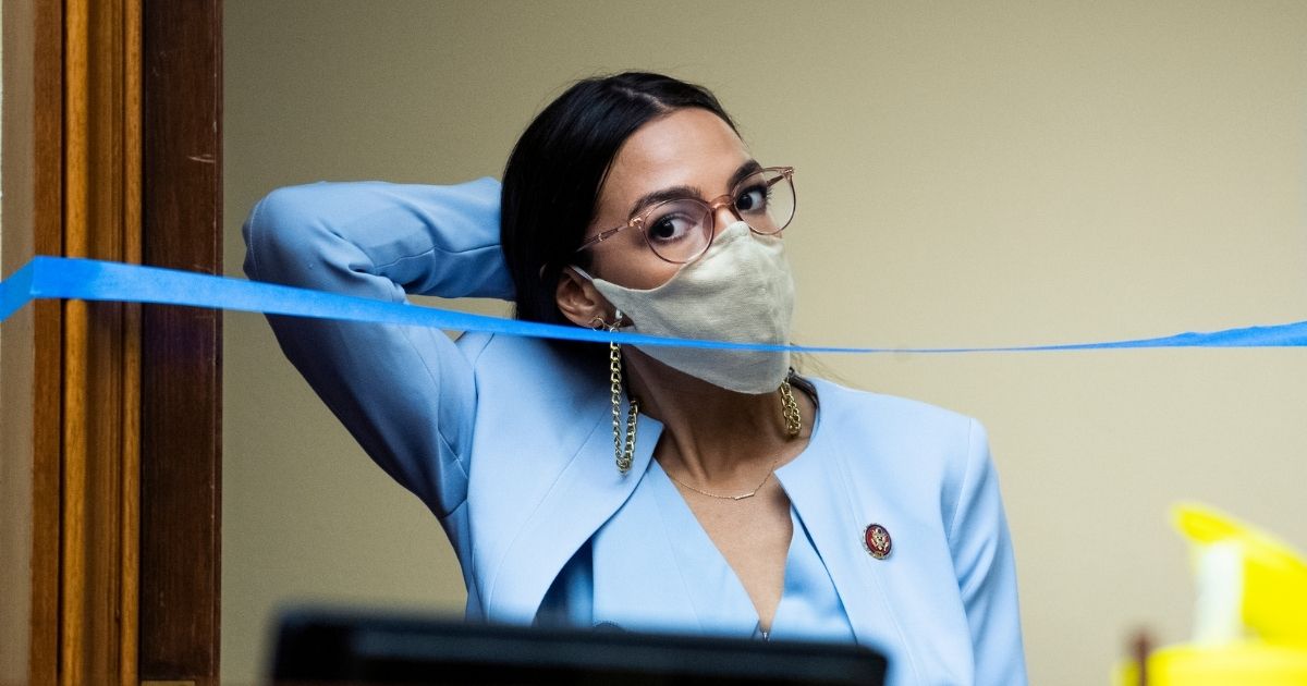 Democratic Rep. Alexandria Ocasio-Cortez of New York arrives for a hearing before the House Oversight and Reform Committee on Aug. 24, 2020, in Washington, D.C.