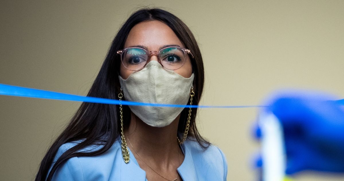 New York Democratic Rep. Alexandria Ocasio-Cortez arrives for a hearing before the House Oversight and Reform Committee on Aug. 24, 2020, in Washington, D.C.