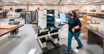 Ballots from the presidential election are counted at the Maricopa County Election Department in Phoenix on Nov. 5.