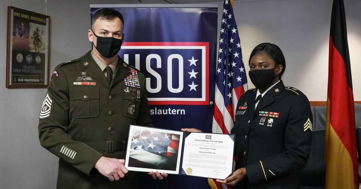 U.S. Army Sgt. Mary Ehiarinmwian receiving the USO Soldier of the Year Award in Germany on Tuesday.