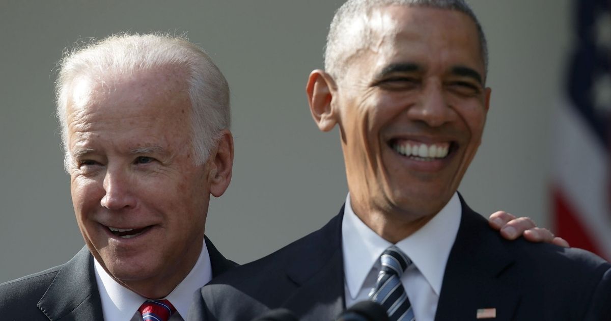 Then-President Barack Obama and Vice President Joseph Biden share a laugh during an event in the Rose Garden of the White House on Nov. 9, 2016.