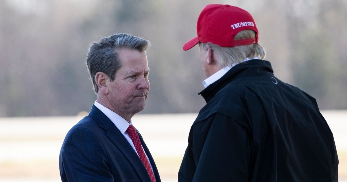 Georgia Gov. Brian Kemp, left, greets President Donald Trump as he steps off Air Force One during arrival March 6, 2020, at Dobbins Air Reserve Base in Marietta, Georgia.