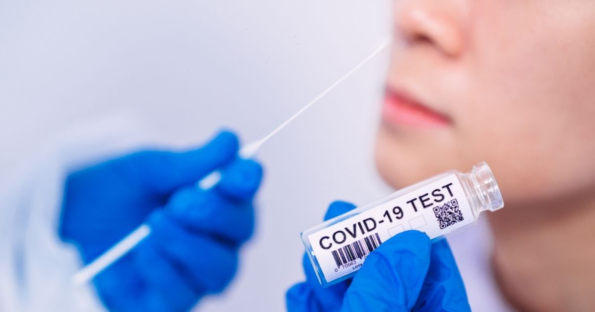 The stock image above shows a doctor holding a kit for the coronavirus test.