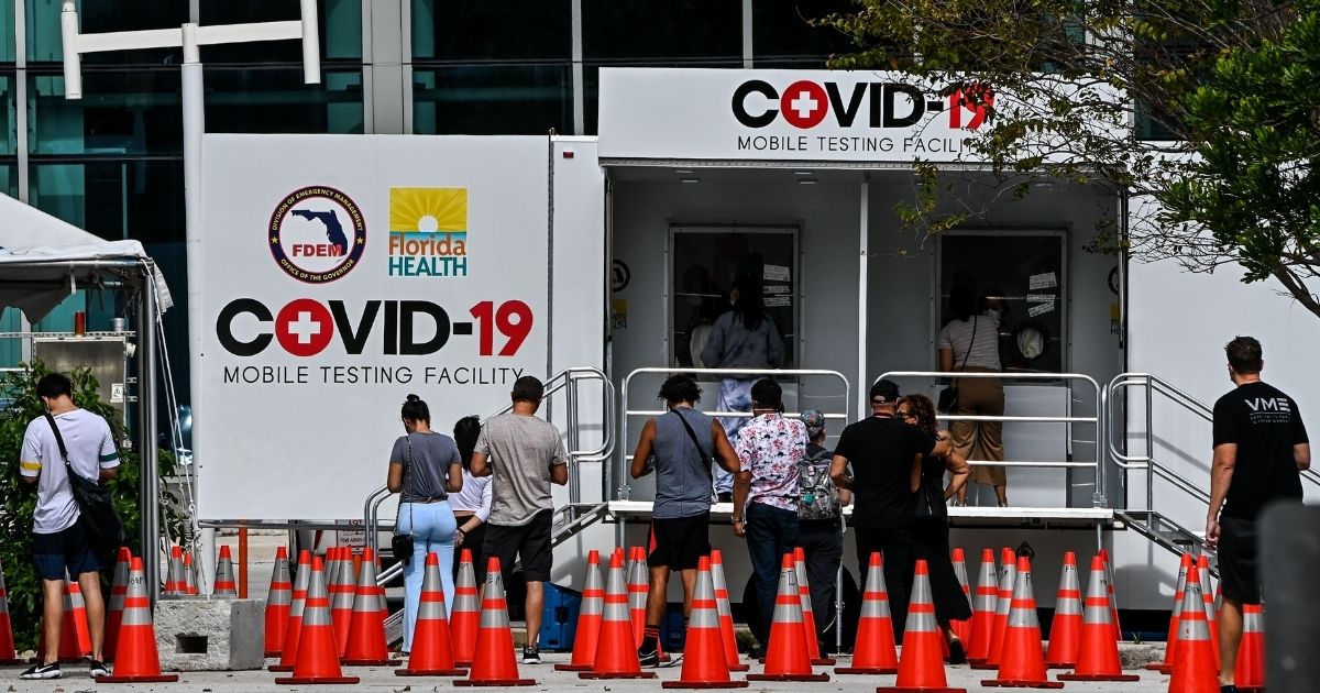 People line up at a walk-in COVID-19 testing site in Miami Beach, Florida, on Nov. 17.