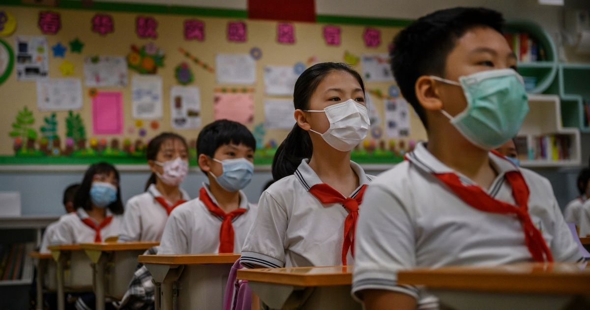 Chinese students wear protective mask as they listen during a class at Chaoyang Experimental Primary School on Sept 23, 2020,, in Beijing, China.