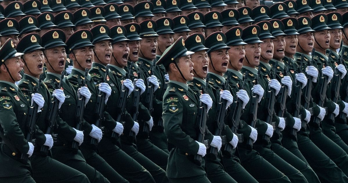 Chinese soldiers shout as they march in formation during a parade Oct. 1, 2019, in Beijing's Tiananmen Square to celebrate the 70th anniversary of the founding of the People's Republic of China.