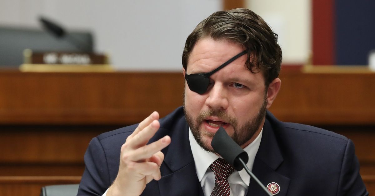 Republican Rep. Dan Crenshaw of Texas questions witnesses during a House Homeland Security Committee hearing on Sept. 17, 2020, in Washington, D.C.