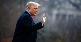 President Donald Trump waves as he departs on the South Lawn of the White House Saturday.