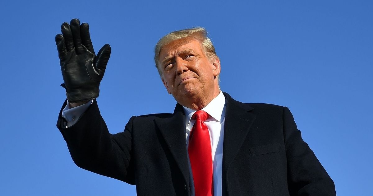 President Donald Trump waves as he arrives at a campaign rally at Green Bay Austin Straubel International Airport in Green Bay, Wisconsin, on Oct. 30, 2020.