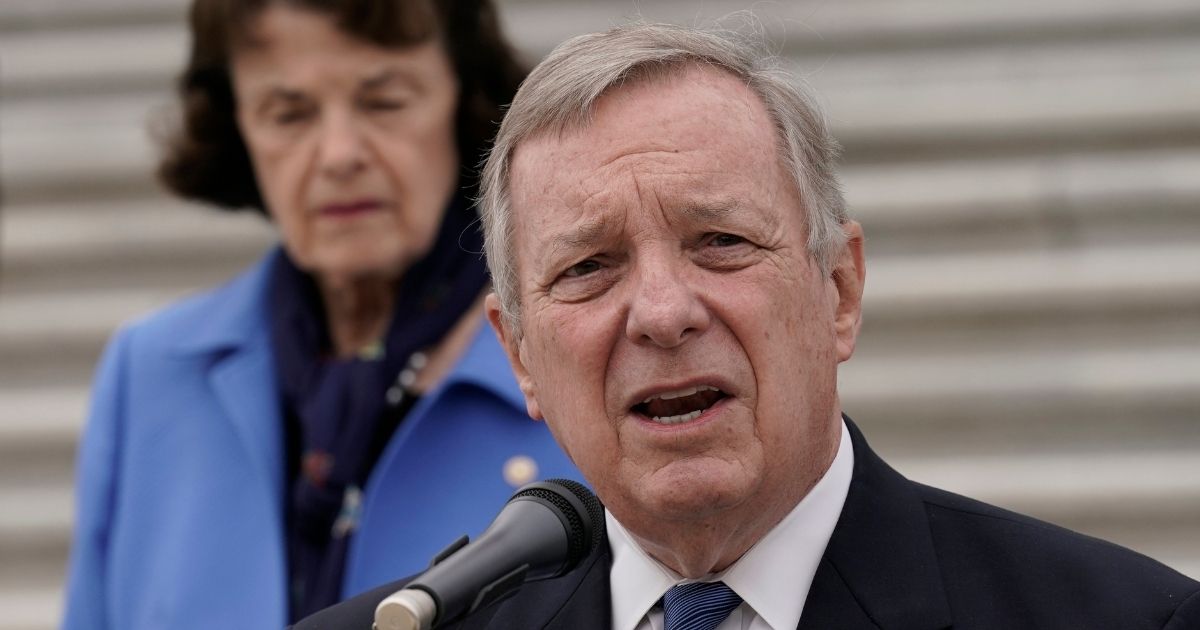 Illinois Sen. Dick Durbin, joined by California Sen. Dianne Feinstein, left, and other Democratic members of the Senate Judiciary Committee, speaks at a news conference Oct. 22 in Washington.