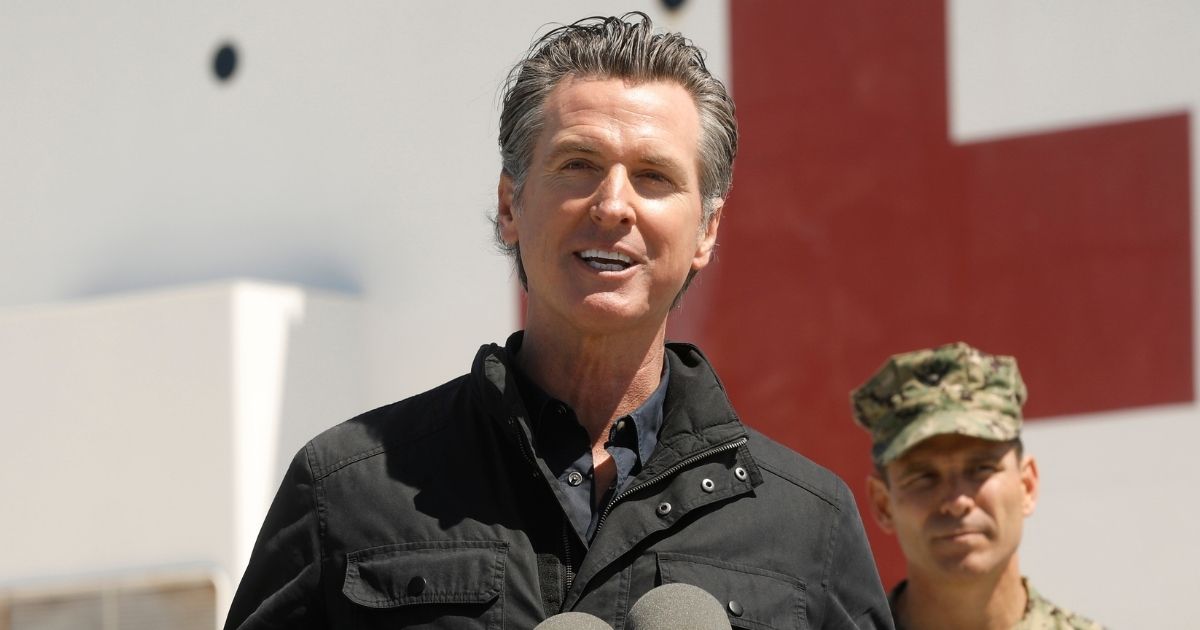 California Gov. Gavin Newsom speaks in front of the hospital ship USNS Mercy that arrived into the Port of Los Angeles on March 27, 2020, to provide relief for Southland hospitals overwhelmed by the coronavirus pandemic.