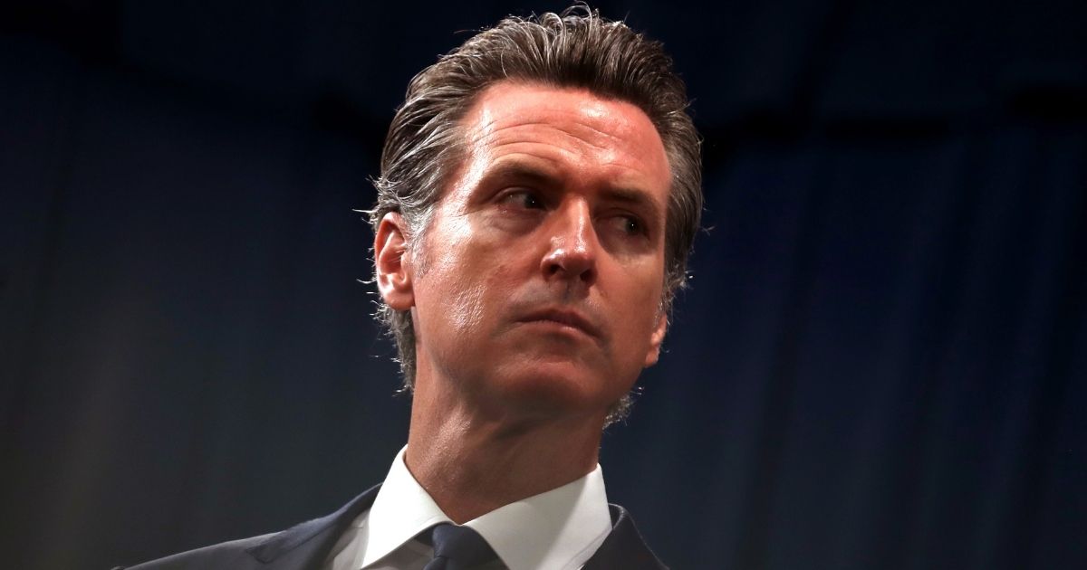 California Gov. Gavin Newsom looks on during a news conference at the state Capitol in Sacramento on Aug. 16, 2019.