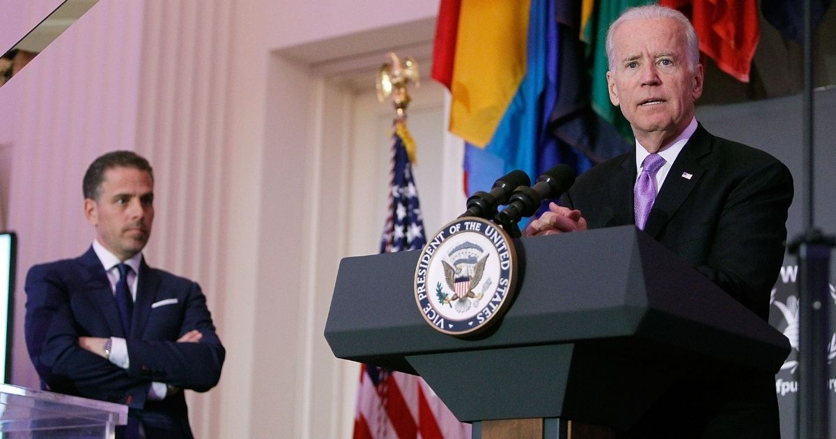 Then-Vice President Joe Biden, right, speaks as his son Hunter Biden looks on at the World Food Program USA's Annual McGovern-Dole Leadership Award Ceremony at the Organization of American States on April 12, 2016, in Washington, D.C.