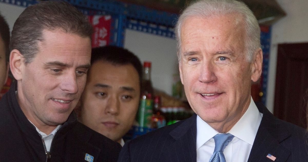 Then-Vice President Joe Biden, right, and his son, Hunter, tour a Hutong alley in Beijing on Dec. 5, 2013, during an official visit to China.