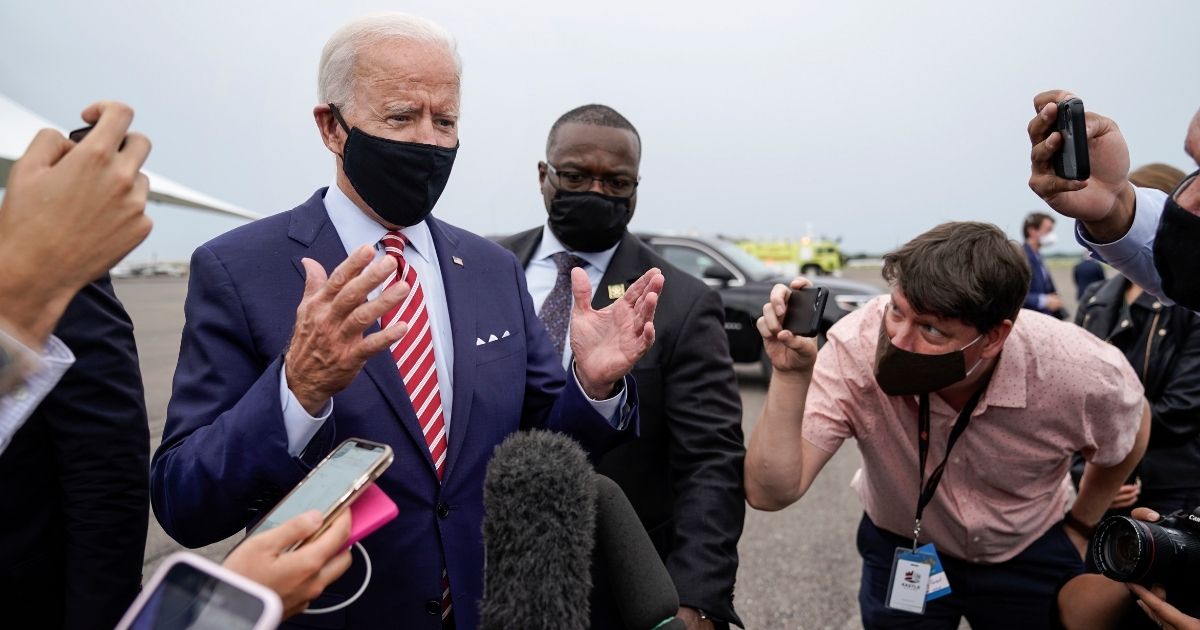 Presumptive president-elect Joe Biden briefly speaks to reporters before boarding his plane at Tampa International Airport after a roundtable event with military veterans at Hillsborough Community College on Sept. 15, 2020, in Tampa, Florida.