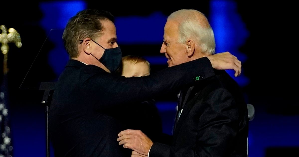 Joe Biden, right, embraces his son Hunter Biden after delivering remarks in Wilmington, Delaware.
