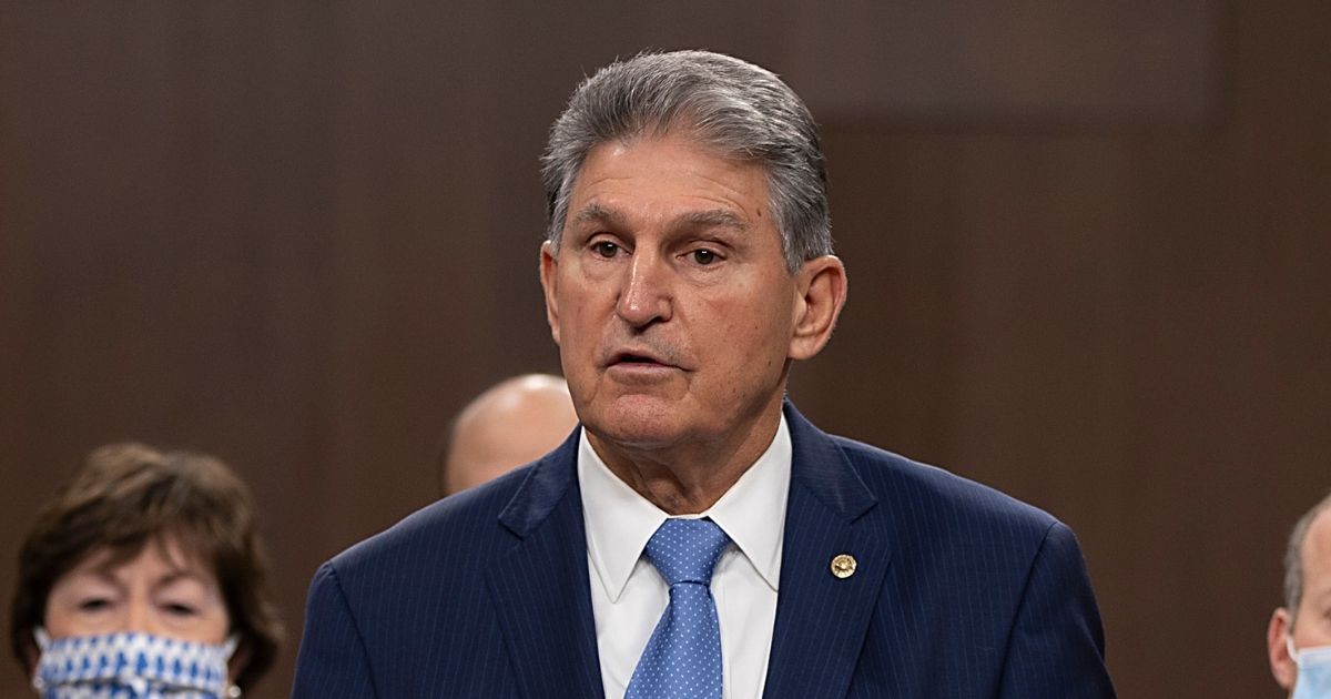 Democratic Sen. Joe Manchin of West Virginia speaks alongside a bipartisan group of Democratic and Republican members of Congress as they announce a proposal for a COVID-19 relief bill on Capitol Hill in Washington, D.C., on Tuesday.