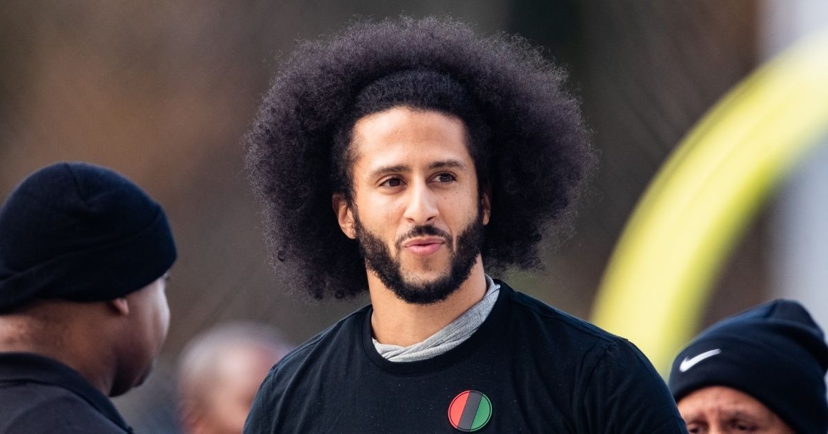 Colin Kaepernick looks on during his NFL workout held at Charles R. Drew high school on Nov. 16, 2019, in Riverdale, Georgia.