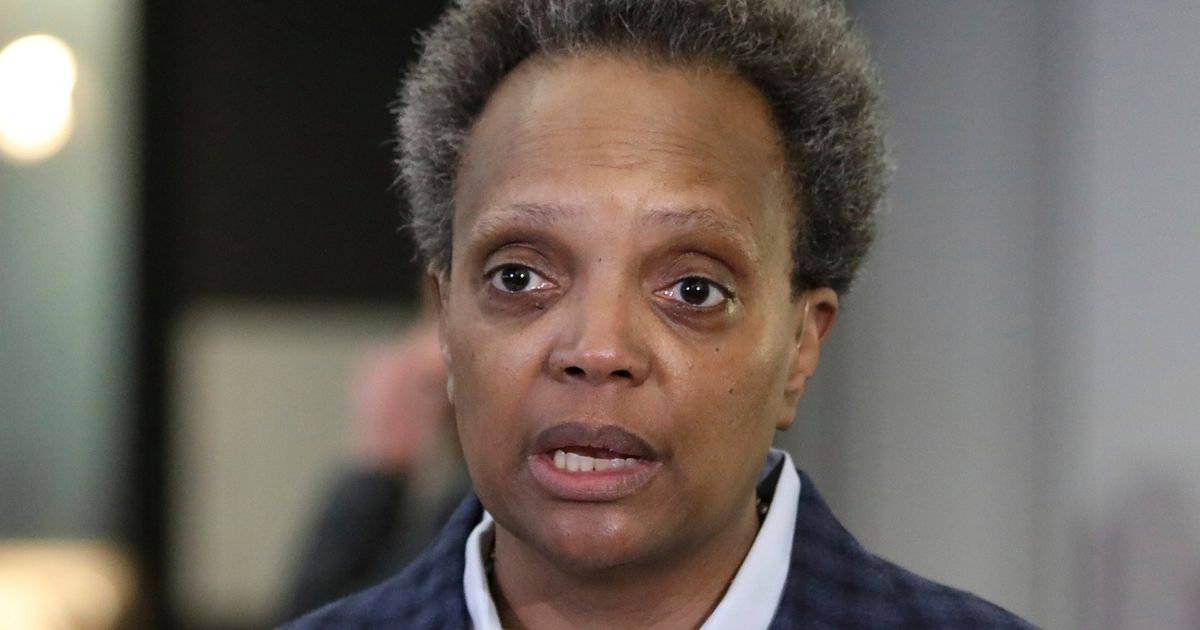 Chicago Mayor Lori Lightfoot speaks to reporters at the city's O'Hare International Airport on March 15.
