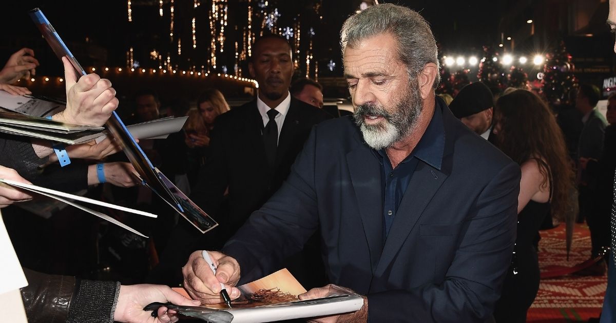 Mel Gibson signs autographs at the UK Premiere of "Daddy's Home 2" at Vue West End on Nov. 16, 2017, in London, England.