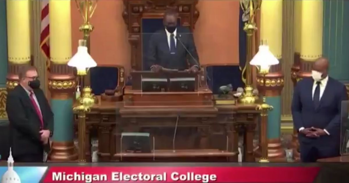 Michigan's presidential electors stand for the singing of the so-called "black national anthem."