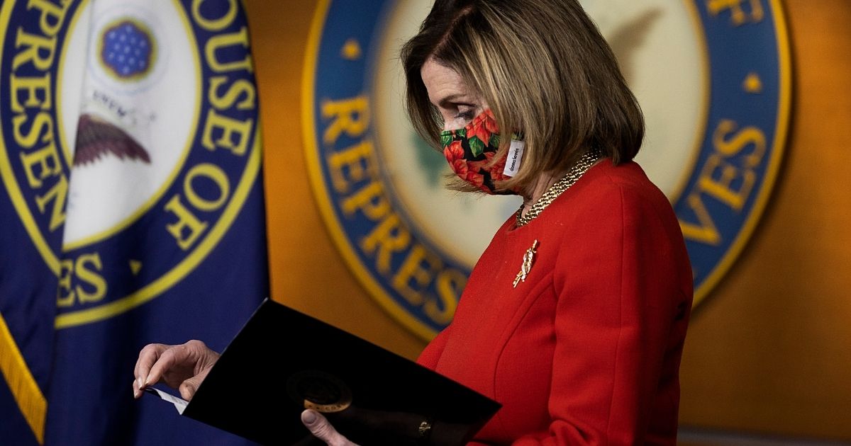 Speaker of the House Nancy Pelosi looks on during a press conference on Capitol Hill on Dec. 20 in Washington, D.C.