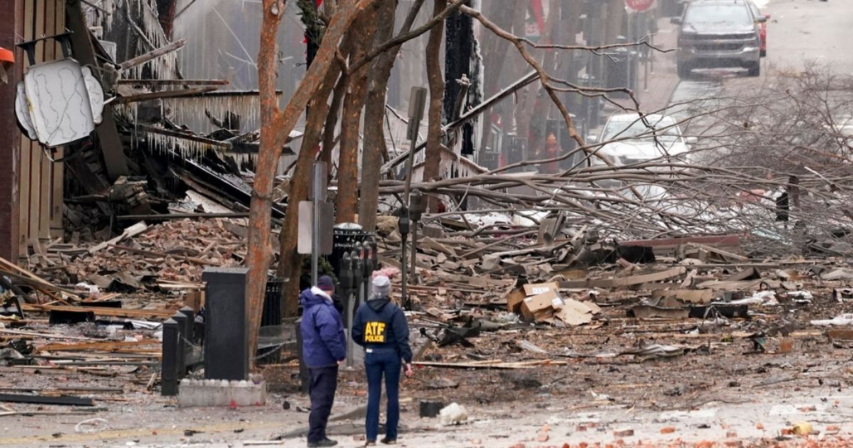 Emergency personnel work near the scene of an explosion in downtown Nashville on Friday.